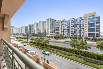 a balcony with a view of a street and buildings at StoneTree - Luxurious 2 BR Apartment in Palm Jumeirah in Dubai