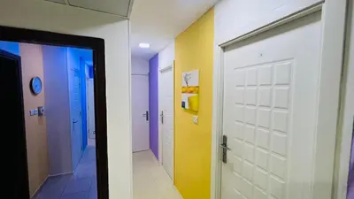 two images of a bathroom with a door and a hallway at Single Partition Room in Al Barsha 1 Near Mashreq Metro in Dubai