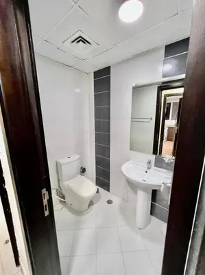 a bathroom with a toilet and a sink at Single Partition Room in Al Barsha 1 Near Mashreq Metro in Dubai