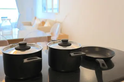 two pots and pans sitting on top of a table at Deluxe 1 Bedroom Apartment - Elite Residence Dubai Marina - Sea View in Dubai