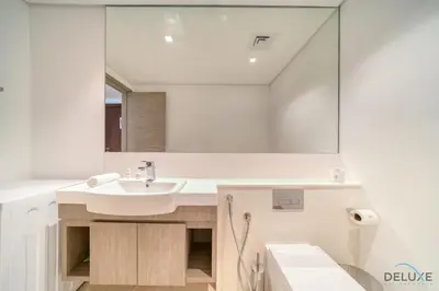 a bathroom with a sink and a mirror at Exclusive Offer Cozy Stay with Burj Khalifa Views by Deluxe Holiday Homes in Dubai