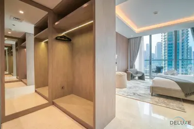 a bedroom with a bed and a view of a city at Exclusive Offer Cozy Stay with Burj Khalifa Views by Deluxe Holiday Homes in Dubai