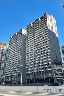 two tall buildings in a city at Exclusive Offer Cozy Stay with Burj Khalifa Views by Deluxe Holiday Homes in Dubai