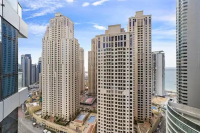 a view of tall buildings in a city at StoneTree - Near JBR Beach - Prime Location in Dubai