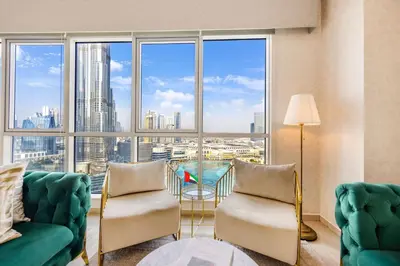 a living room with a large window with a view of the city at Durrani Homes - Grandiose 5BR Besides Dubai Mall with Burjkhalifa and Fountain view in Dubai