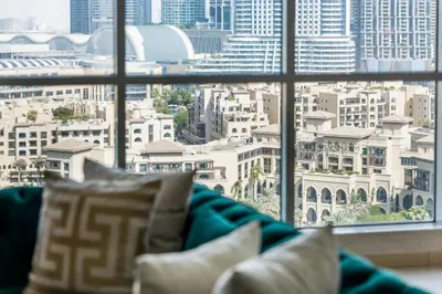 a view of a city from a window at Durrani Homes - Lavish 3BR Besides Burj Khalifa and Fountain view in Dubai