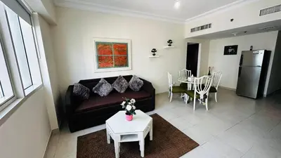 a living room with a couch and a table at Lakeshore Towers, Cluster Y , JLT, 1BHK in Dubai