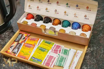 a box filled with different types of cookies at Marco Polo - Relax in a modern 1BR in Dubai Marina in Dubai