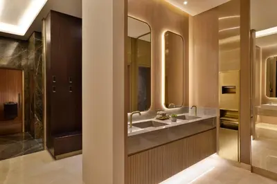 a bathroom with a sink and two mirrors at Hilton Garden Inn Dubai Business Bay in Dubai