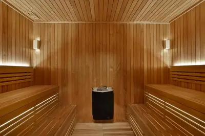 a sauna with a trash can in the middle at Hilton Garden Inn Dubai Business Bay in Dubai