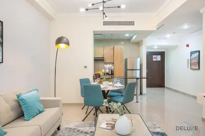 a living room with a couch and a table at Dazzling 1BR at Marina Crown Dubai Marina by Deluxe Holiday Homes in Dubai