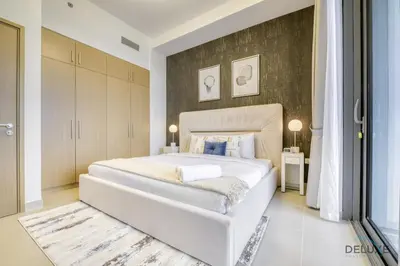 a bedroom with a large white bed in a room at Sleek 1BR at 5242 Tower 1 Dubai Marina by Deluxe Holiday Homes in Dubai