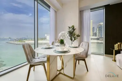 a dining room with a table with chairs and a large window at Sleek 1BR at 5242 Tower 1 Dubai Marina by Deluxe Holiday Homes in Dubai