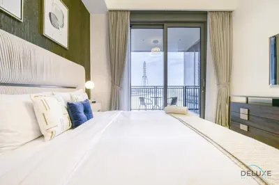 a large white bed in a room with a window at Sleek 1BR at 5242 Tower 1 Dubai Marina by Deluxe Holiday Homes in Dubai
