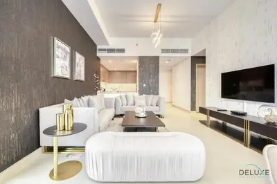 a living room with white furniture and a flat screen tv at Sleek 1BR at 5242 Tower 1 Dubai Marina by Deluxe Holiday Homes in Dubai