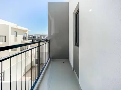 a balcony of a white building with a window at StoneTree - 3 BR with 1 Maids Room Villa in Camelia - Arabian Ranches in Dubai