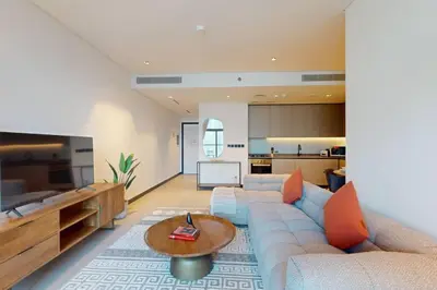 a living room with a couch and a table at 15 Northside A - Pristine Two Bedroom in Dubai