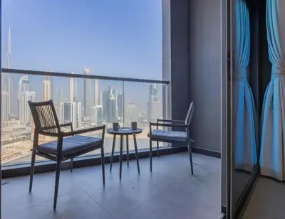 a balcony with a table and two chairs and a view at 15 Northside A - Pristine Two Bedroom in Dubai