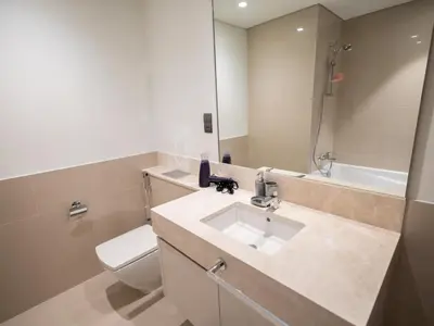 a bathroom with a sink and a toilet and a tub at MH - Act One Act Two - DownTown - 1BHK - REF505 in Dubai