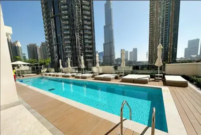 a swimming pool on the roof of a building at MH - ACT TOWER - Downtown -1Bedroom Apartment - REF504 in Dubai