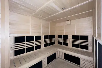 a sauna with black and white panels in a room at GuestReady - Majestic canal and Burj Khalifa view in Dubai