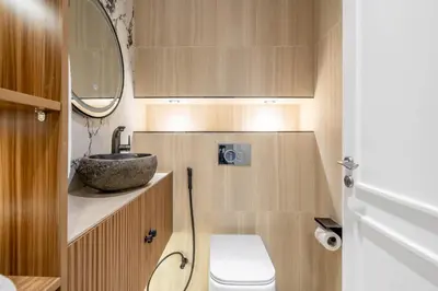 a small bathroom with a sink and a toilet at GuestReady - Modernity elegance in Dubai Marina in Dubai