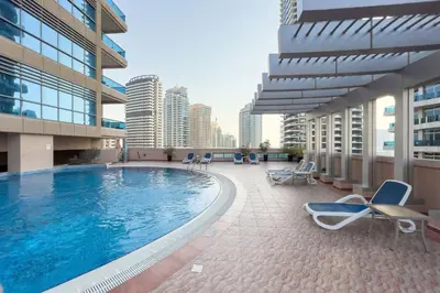 a swimming pool on the side of a building at GuestReady - Modernity elegance in Dubai Marina in Dubai