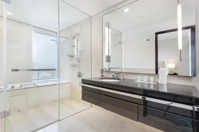 a bathroom with a sink and a mirror at Marina Canal Views 2BR Unit Next to Marina Mall, The Address Residences, Dubai Marina by Deluxe Holiday Homes in Dubai