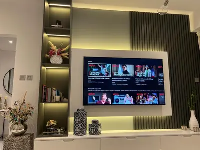 a flat screen tv on a wall in a living room at 8 Boulevard Walk 'Heart of Downtown' in Dubai