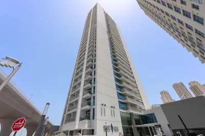 a tall building in the middle of a city at StoneTree - Best Rate Studio in Dubai Marina in Dubai
