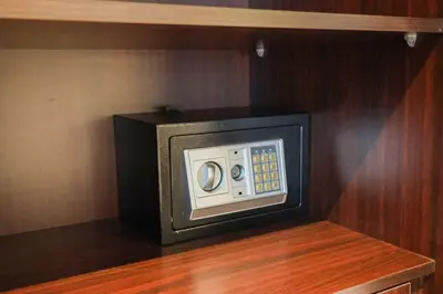 a small microwave oven sitting on a wooden shelf at Deluxe - Amazing views - Elite in Dubai