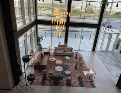 an overhead view of a living room with a table at Oraya - Apt. With Skyline and Garden View Along With City in Dubai