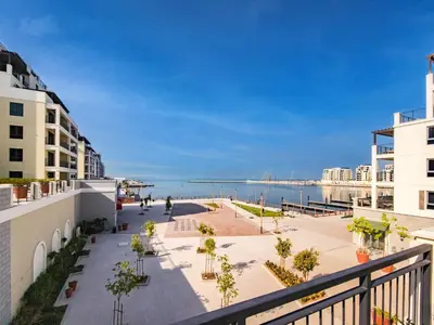 a view of the beach from the balcony of a building at Splendid brand new 1BD apartment near the beach in Dubai