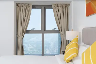 a bedroom with a bed and a large window at Vibrant - Prime Location Dubai Marina - Near Metro in Dubai