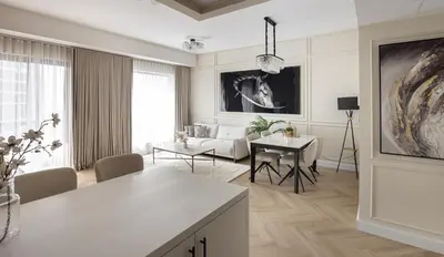 a living room with a couch and a table at Luxury 1 bedroom with beautiful marina view! in Dubai