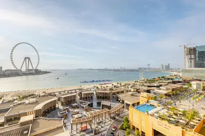 a view of the beach and the ferris wheel at Roda Amwaj Suites Jumeirah Beach Residence in Dubai