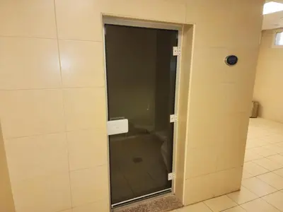 a glass door to a shower in a bathroom at Elite 6 Residence - Sports City by Golden Casa in Dubai