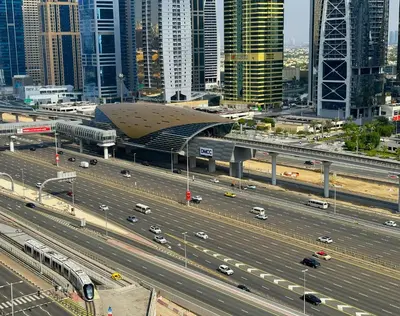 a highway in front of a city with a building at Cool Studio near to Metro & Beach in Dubai Marina in Dubai