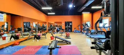 a gym with people exercising on tread machines at Cool Studio near to Metro & Beach in Dubai Marina in Dubai