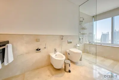a bathroom with a toilet and a bidet at Overlooking Marina Views Next to Marina Mall 1BR Unit, The Address Residences, Dubai Marina by Deluxe Holiday Homes in Dubai