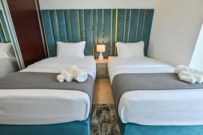 a room with two beds with stuffed animals on them at 54 Floor Palm & Sea View Dubai Marina. LUX / NEW in Dubai
