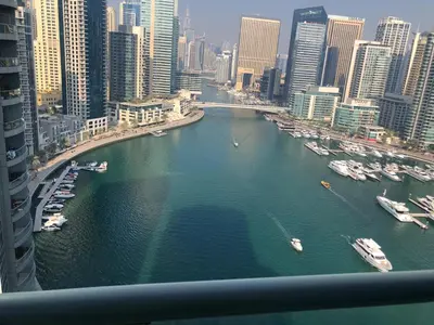 a view of a river with boats in a city at Coliving sharing Hostel 1 in Dubai