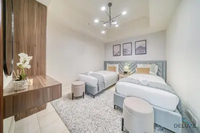 a bedroom with two beds and a desk at Urban 2BR at Al Mesk Tower Dubai Marina by Deluxe Holiday Homes in Dubai