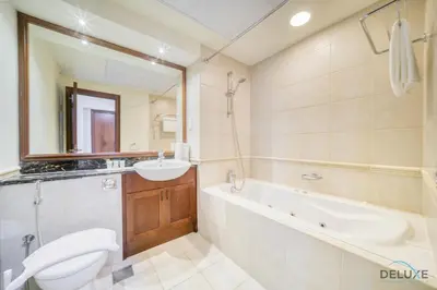 a bathroom with a tub and a sink and a toilet at Urban 2BR at Al Mesk Tower Dubai Marina by Deluxe Holiday Homes in Dubai