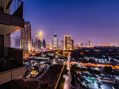 a city skyline at night with a lot of traffic at Phenomenal 2Br in Downtown Views II in Dubai