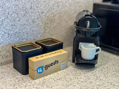 a box of coffee and a cup on a counter at HiGuests - Emaar Beachfront Haven with Majestic Marina Views in Dubai