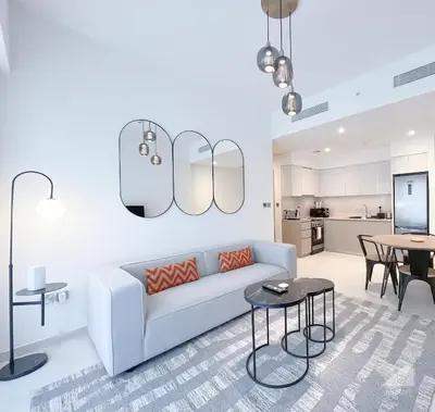 a living room with a couch and a table at Incredible stay at Burj Royale Downtown in Dubai