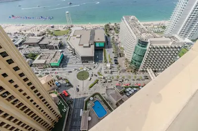 an aerial view of a city with the beach and buildings at JBR Bahar Beach Views 4 beds - DVH Holiday Homes in Dubai