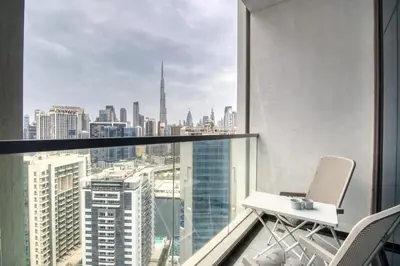 a room with a view of the city from a skyscraper at GuestReady - Lavish studio with Burj Khalifa views in Dubai