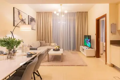 a living room with a couch and a table at Dubai Marina Gate 2 Deluxe Apartment in Dubai